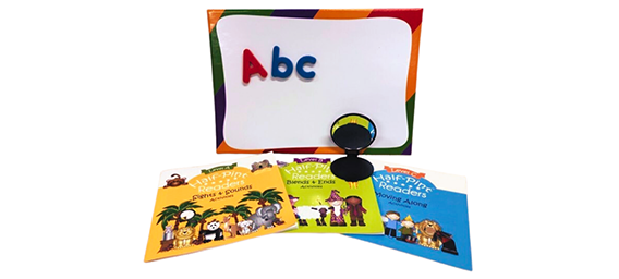 Whiteboard with letter magnets and other literacy materials